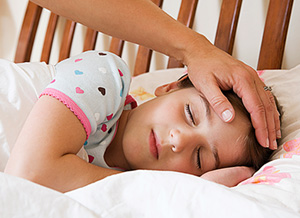 Krankes Mädchen im Bett